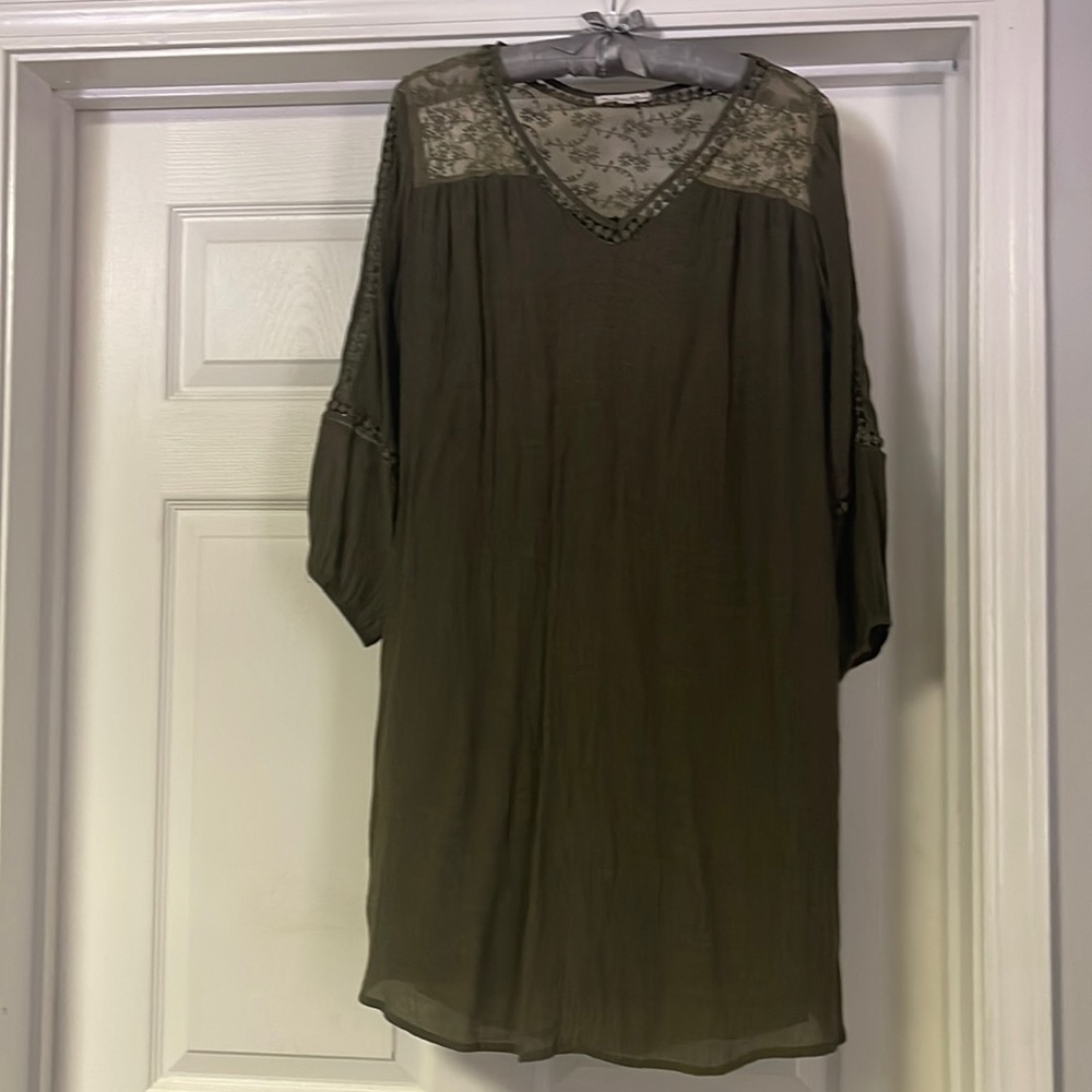 Great dress for fall. This Olive green dress has mid sleeves with lace.